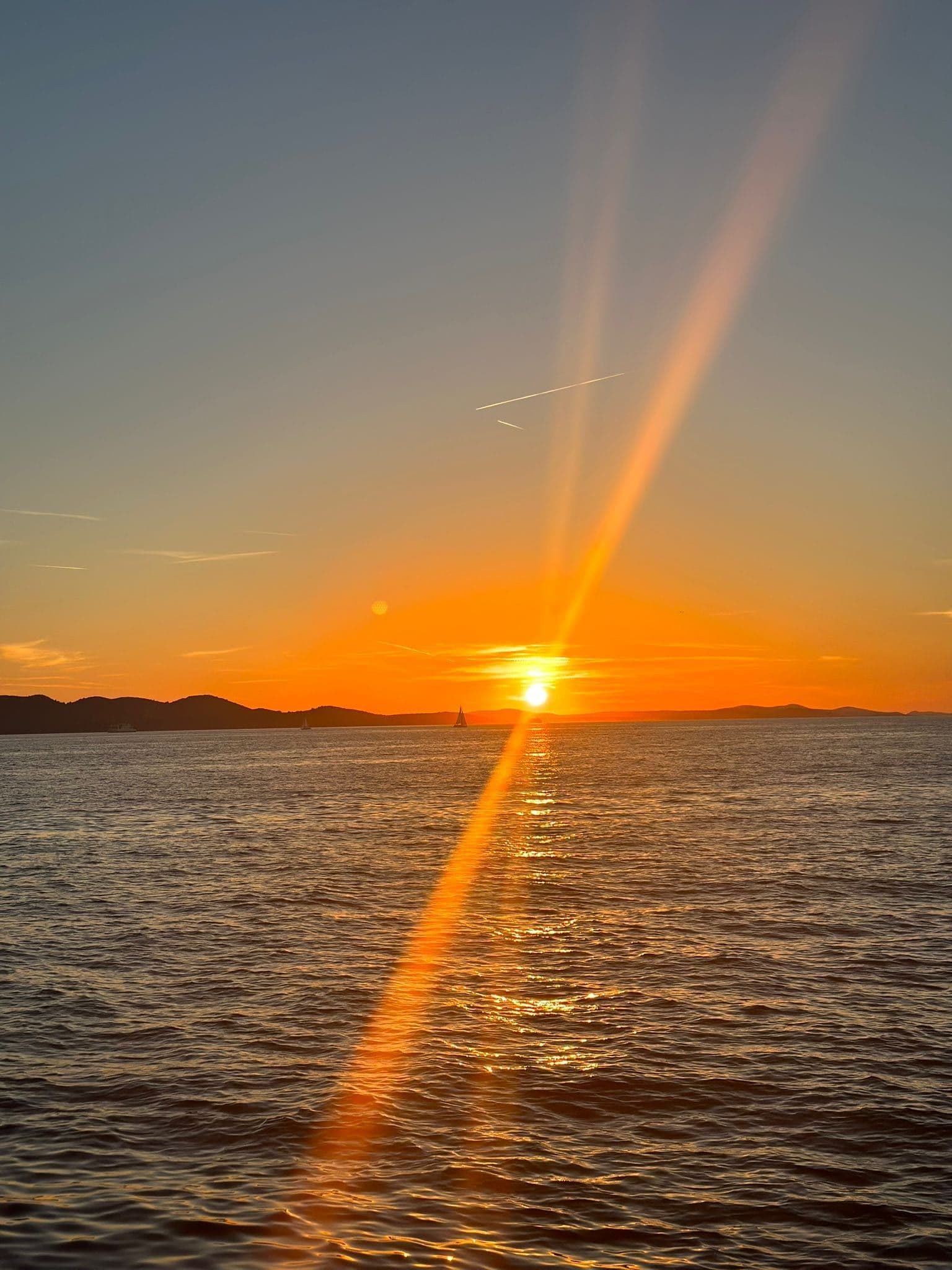 Golden sunset over the Adriatic Sea with Zadar skyline silhouette