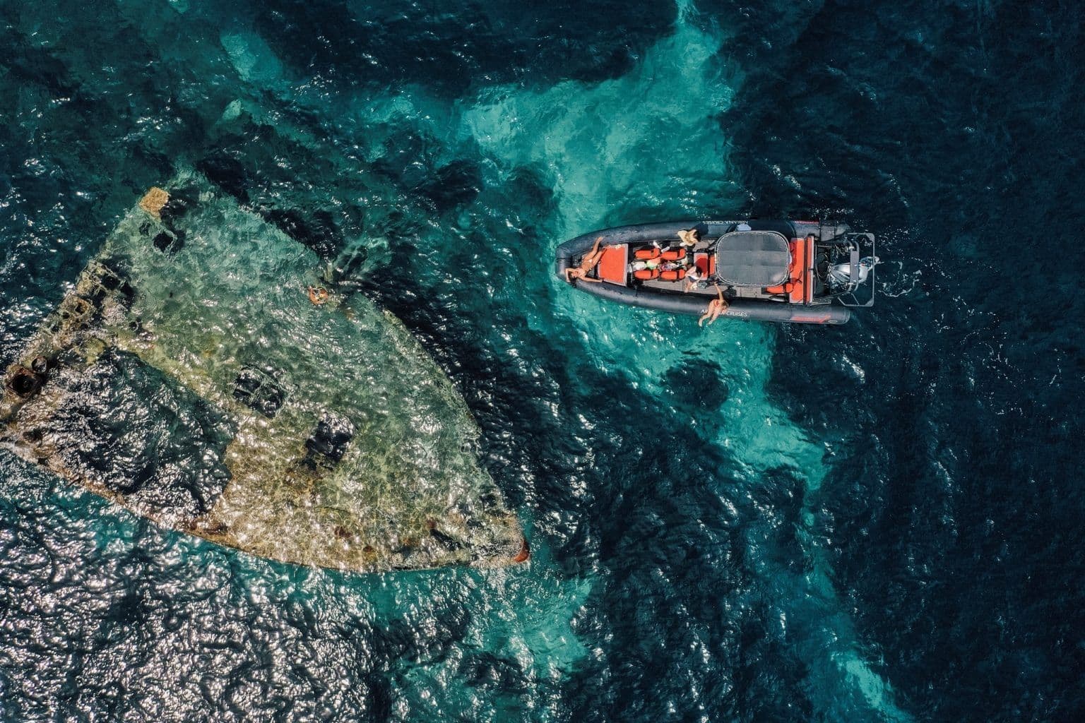 Aerial view of boat in crystal clear Adriatic water